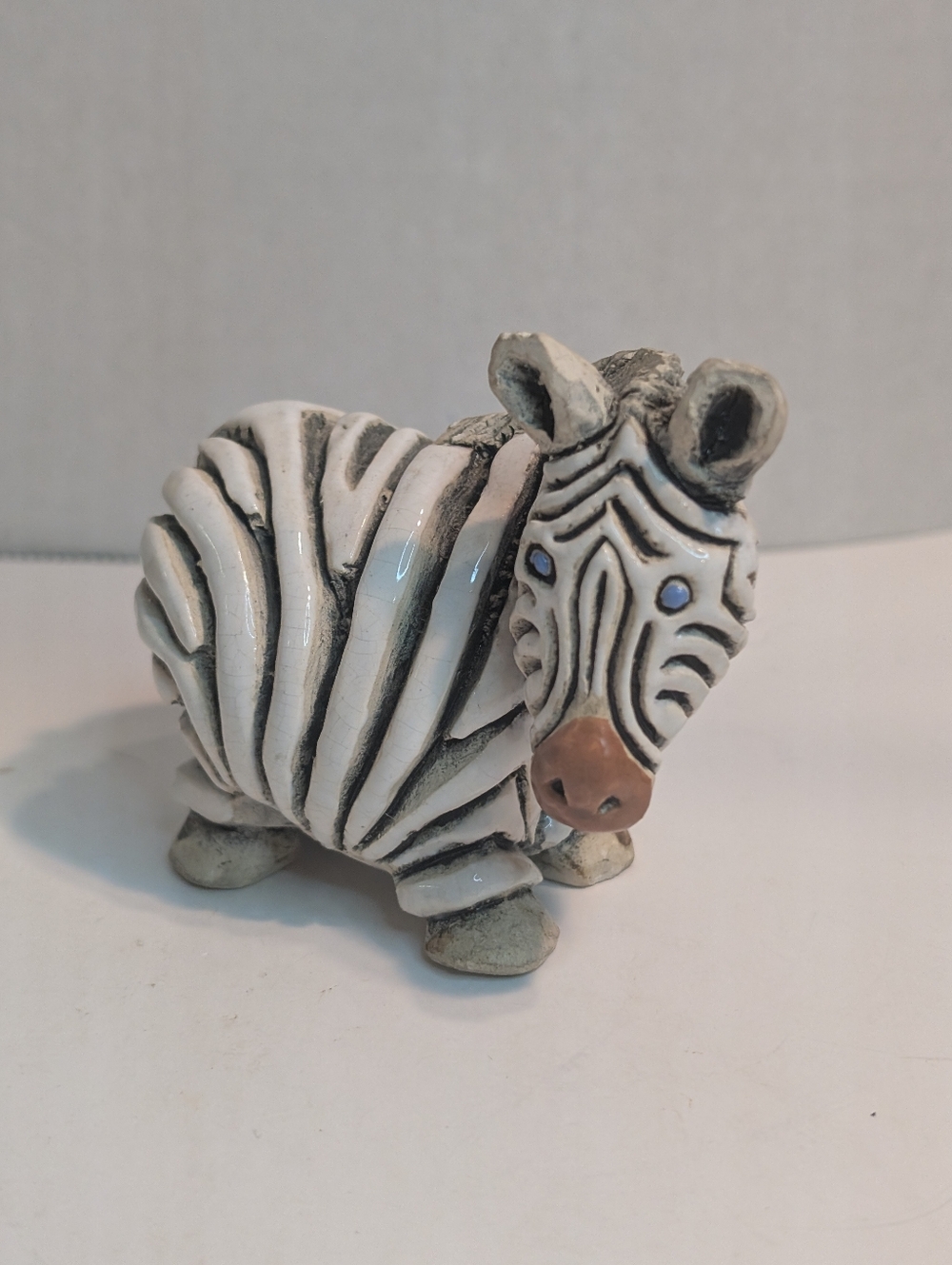 Whimsical Ceramic Zebra Figurine in White and Black.  Small Chip On Ear.